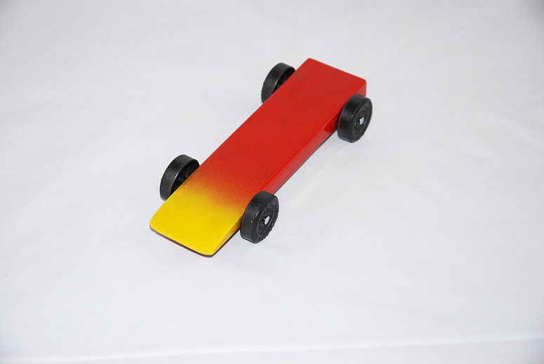 Red and Yellow Pinewood derby car